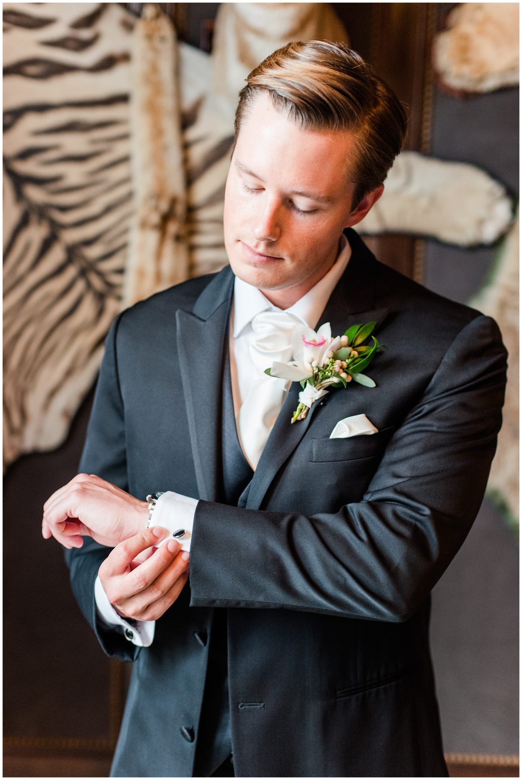 groom getting ready in the billiards room at dover hall estate for january wedding. by richmond rva wedding photographer, sarah & dave photography.
